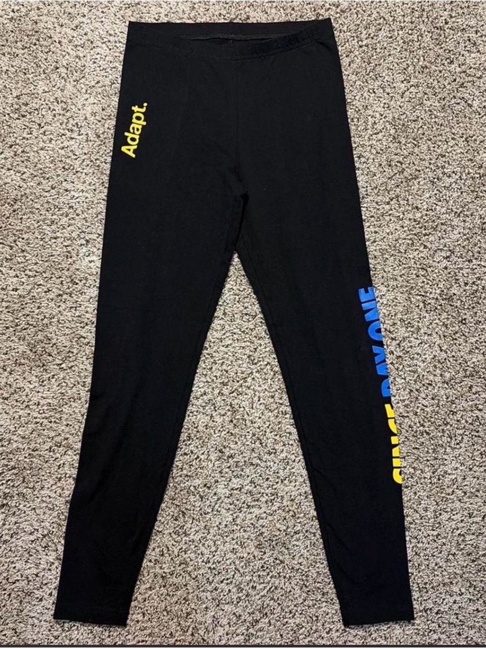 Adapt Leggings with Yellow and Blue Accent that reads “SINCE DAY ONE”